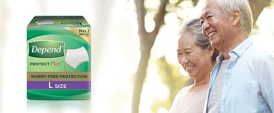elderly couple smiling outdoors with Depend protection Pants product pack, and a 'learn more' button